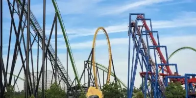 Six Flags Great Adventure Jackson, New Jersey colorful roller coaster tracks against a clear sky.